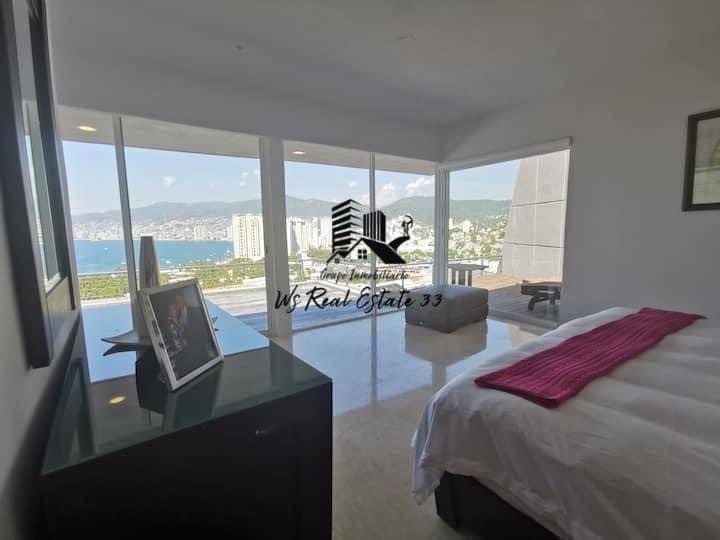 casa-con-vista-a-la-baha-y-jardn-en-venta5-30113